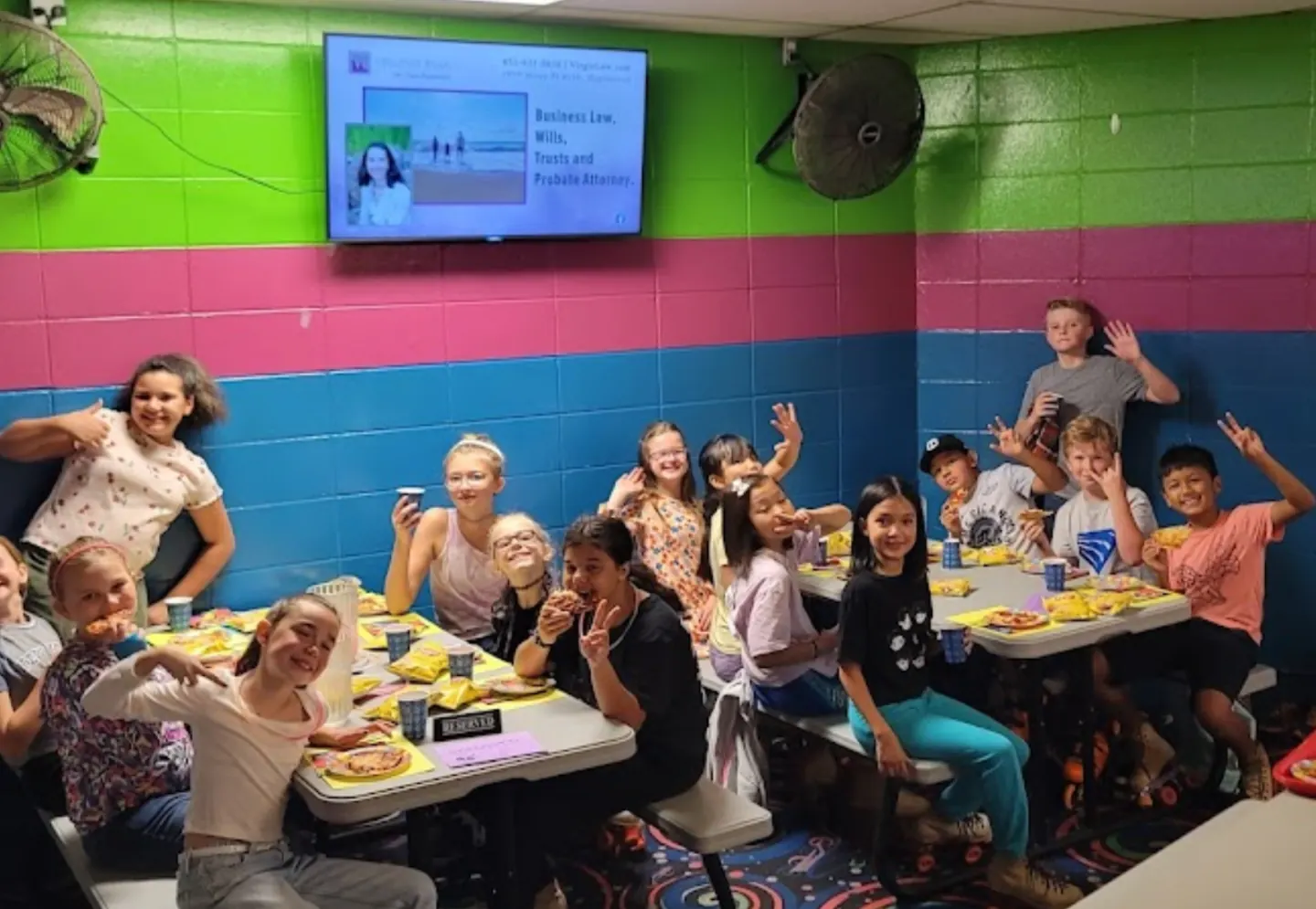 Friends celebrating around the birthday tables at Skateville